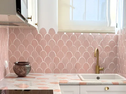 Pink kitchen backsplash with zellige shell shaped tiles